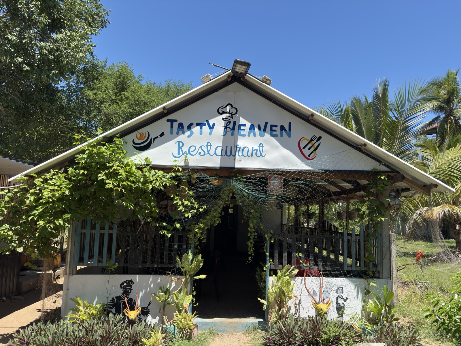Tasty Heaven Restaurant Garden Canopy under palms